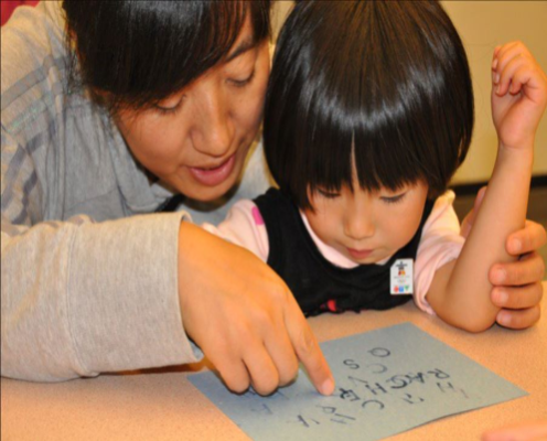 Mother and daughter looking at paper